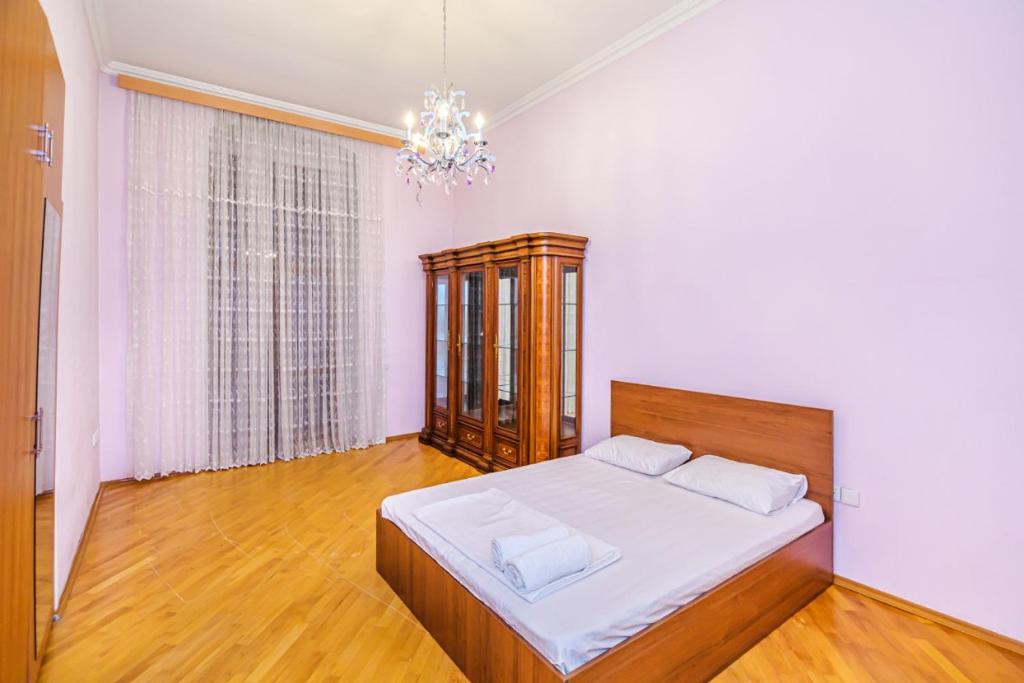 Säng eller sängar i ett rum på GMZA Apartment