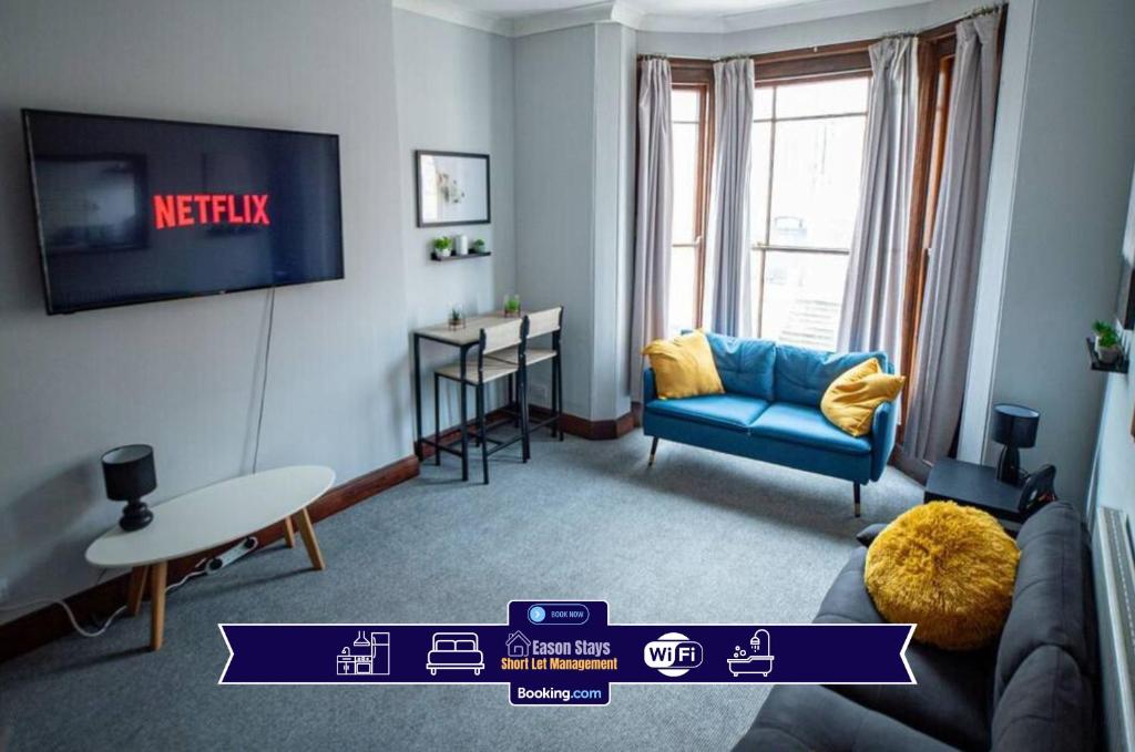 a living room with a couch and a table at One BR Flat By Eason Stays Short Lets & Serviced Accommodation Lowestoft With Free Parking in Lowestoft