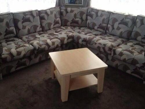 a couch with a coffee table in a living room at Coastfield Holiday Village - Holiday Accommodation 4866 in Ingoldmells