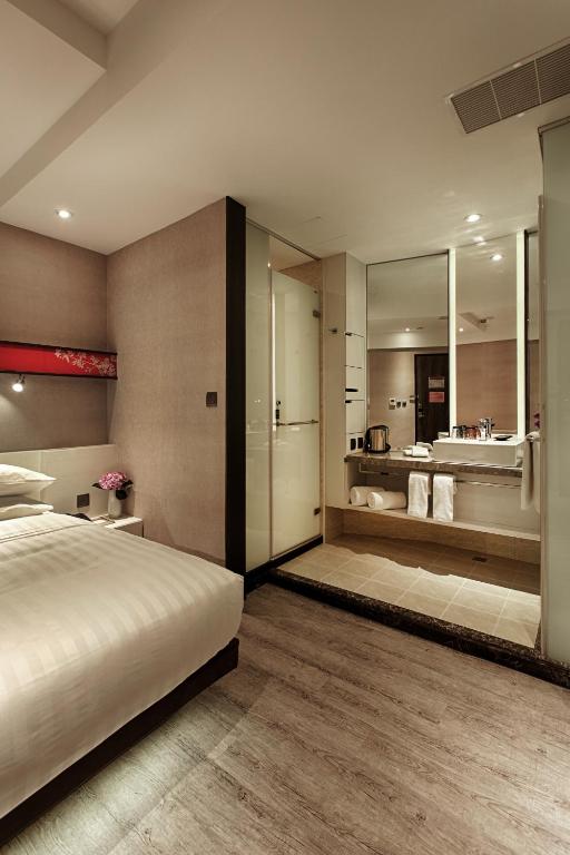Postel nebo postele na pokoji v ubytování City Place Hotel