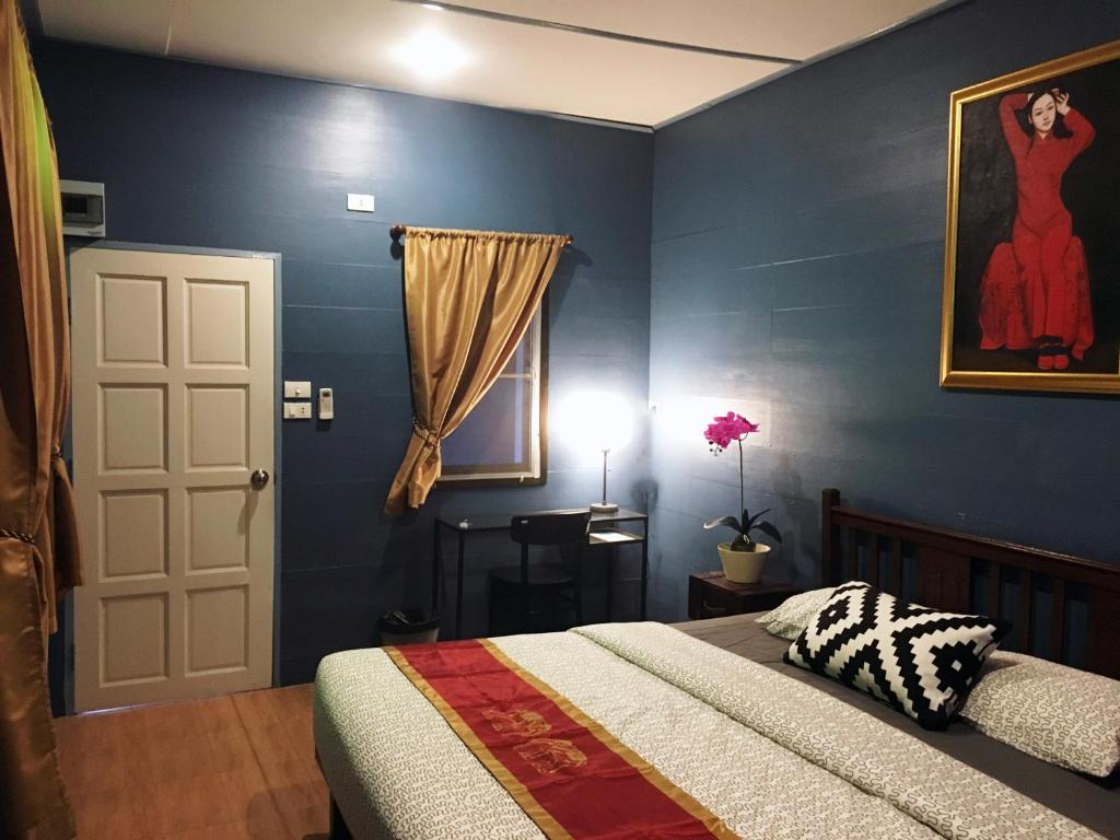 Postel nebo postele na pokoji v ubytování Blue Chang House