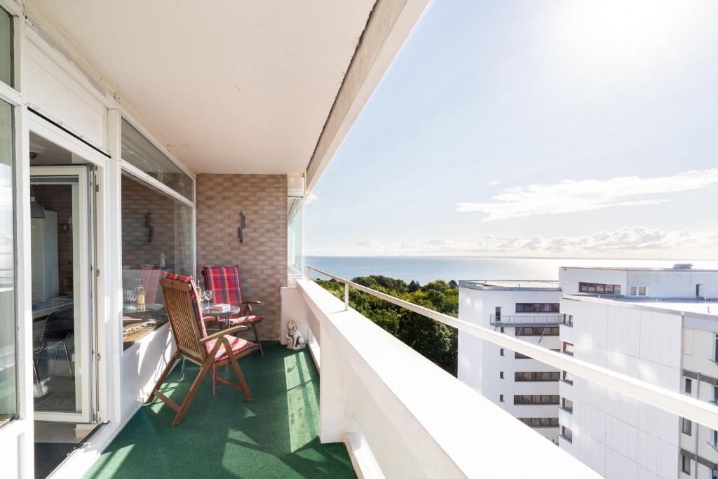 a balcony with a view of the ocean at Panoramic App B08-6 in Sierksdorf