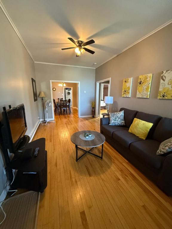 a living room with a couch and a ceiling fan at Westmount Manor Unit 1 - 2 Bedroom Apartment in St. John's