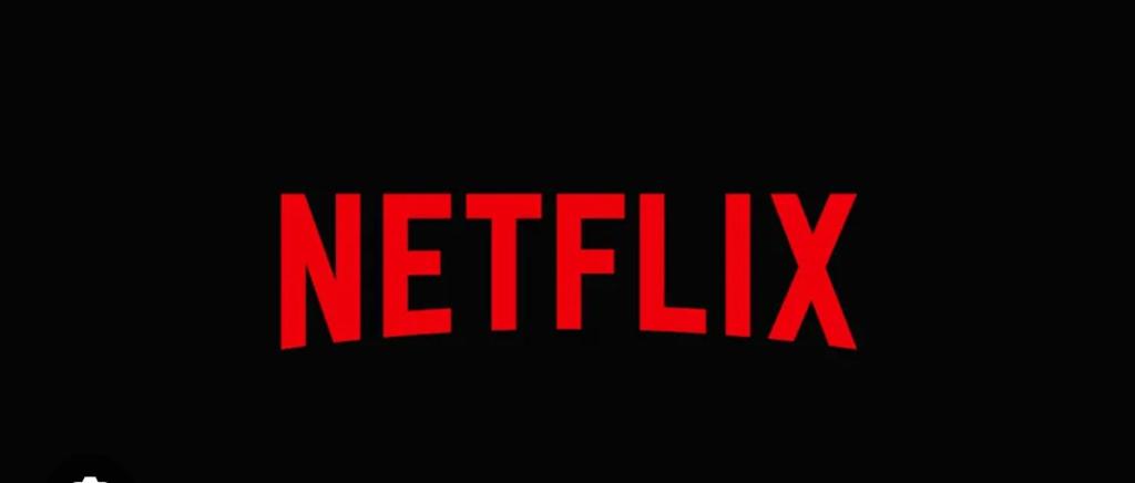 a sign with the word netflix on a black background at Casa Cara in Târgovişte