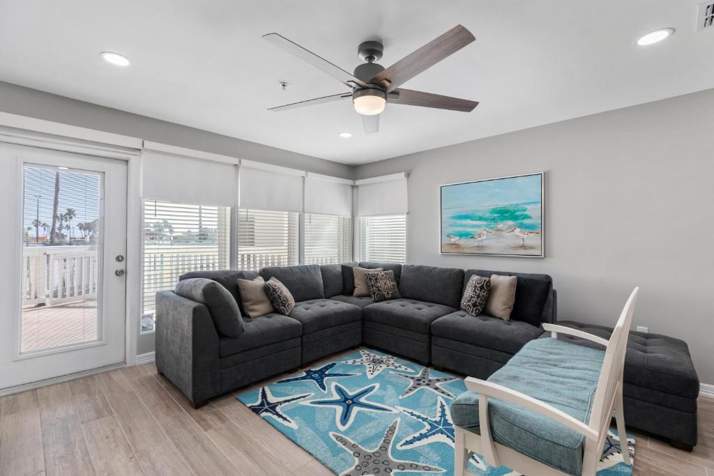 a living room with a couch and a ceiling fan at Gulfpoint Condo unit 2101 condo in South Padre Island