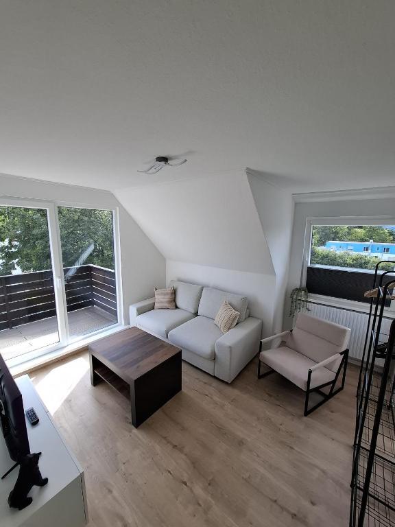 a living room with a couch and a table at Ferienwohnung Balu in Bad Harzburg