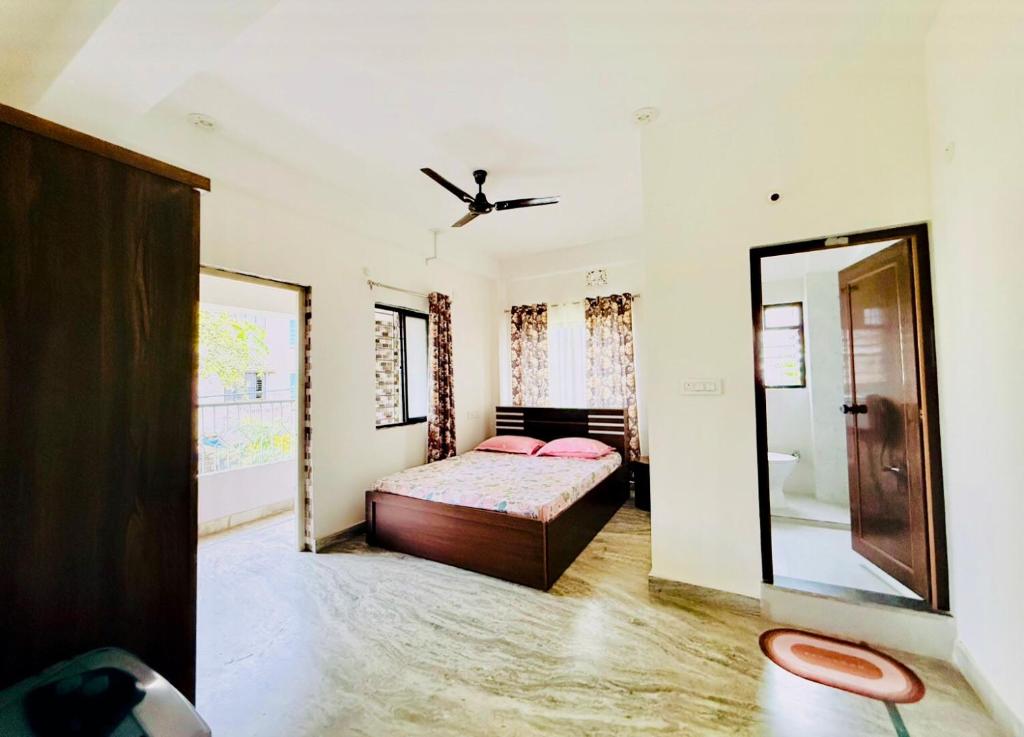 Ένα ή περισσότερα κρεβάτια σε δωμάτιο στο Backpackers Bunkhouse Siliguri
