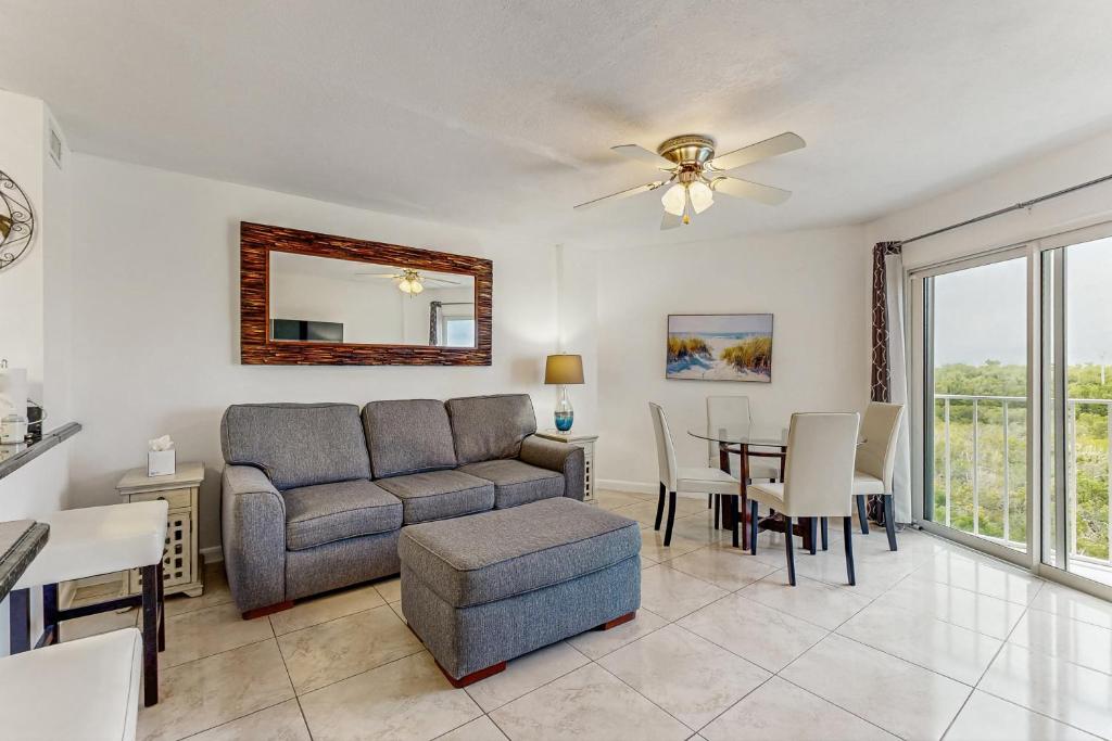 a living room with a couch and a table at Molliner Vacation Retreat in Tavernier