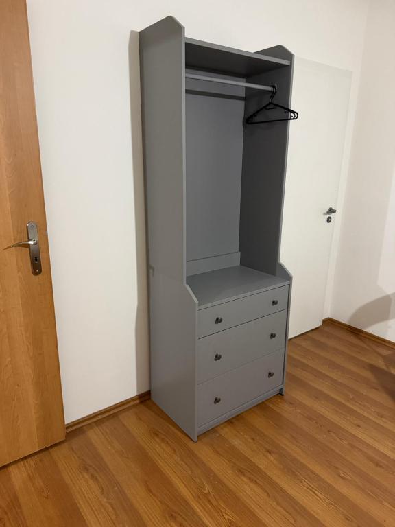 a closet with a dresser and a cabinet in a room at YCZ Praha in Prague