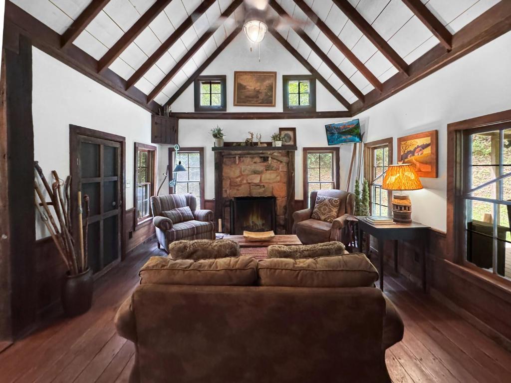 a living room with a couch and a fireplace at JME Retreat in Colwell