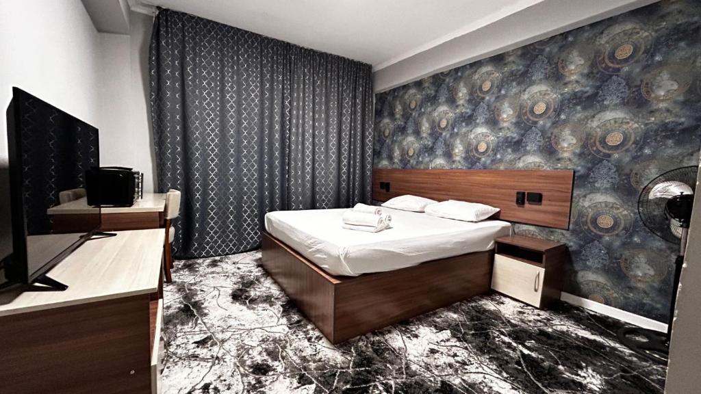 Katil atau katil-katil dalam bilik di Hotel City rooms Bogenbay