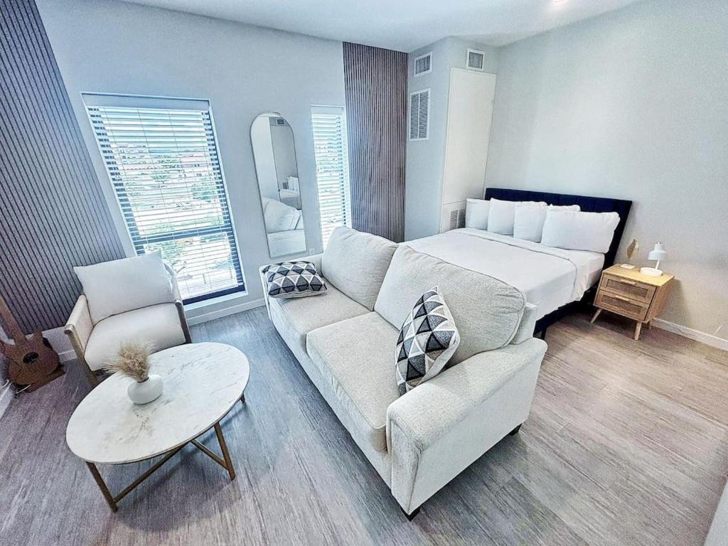 a living room with a couch and a bed at Cloud Nine Studio in Des Moines