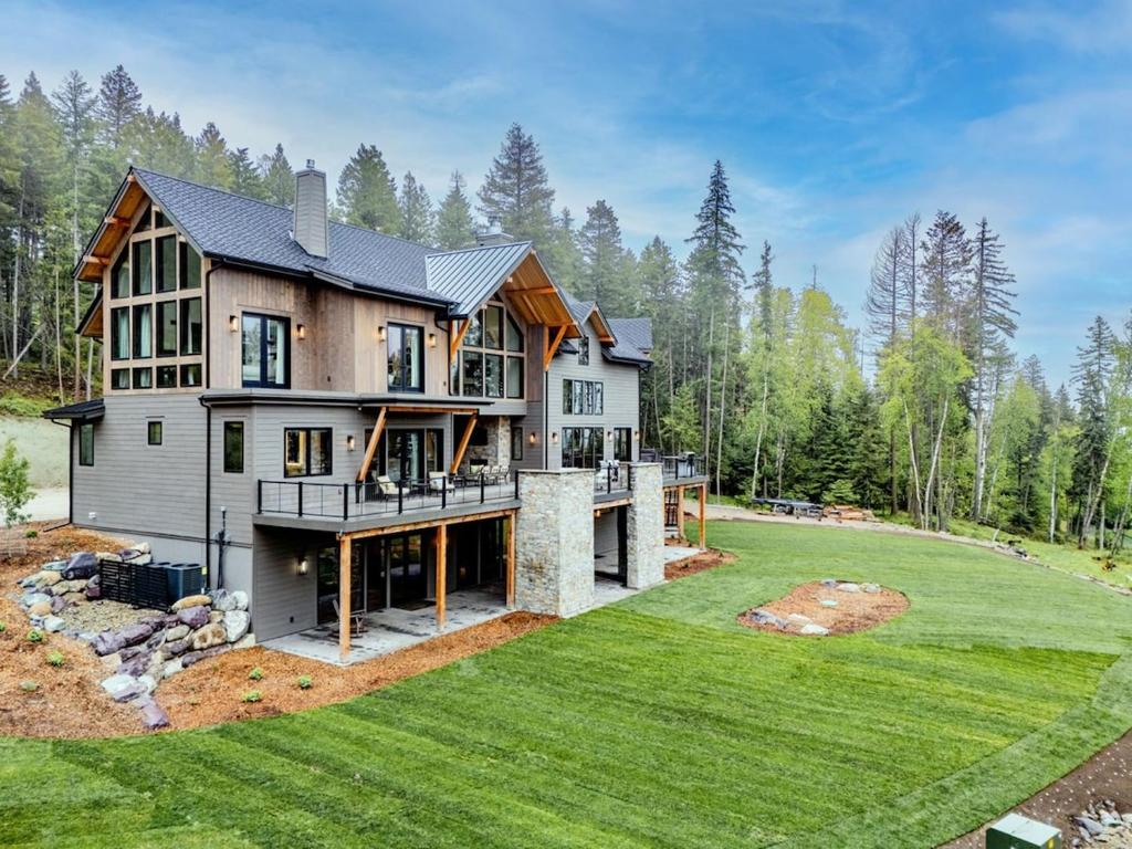 an aerial view of a house with a large yard at Great Northern Mountain Escape in Whitefish