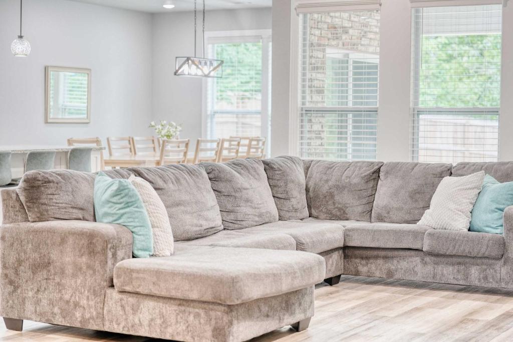 a couch and a chair in a living room at Bike-Friendly Retreat with Fenced Yard & Trails in Dug Hill