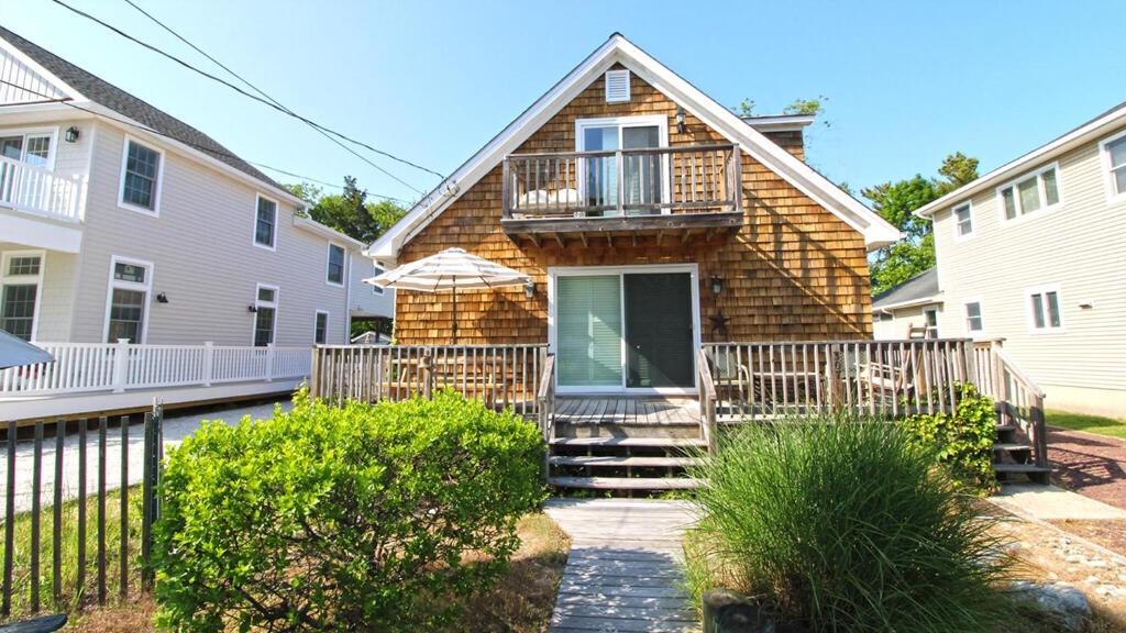 a house with a deck and a balcony at Dunescape in West Cape May