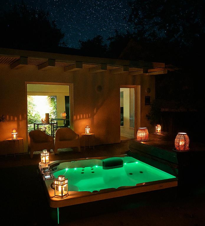 a swimming pool in the middle of a yard at night at Relax u potoka, vířivka, swimSpa, sauna 