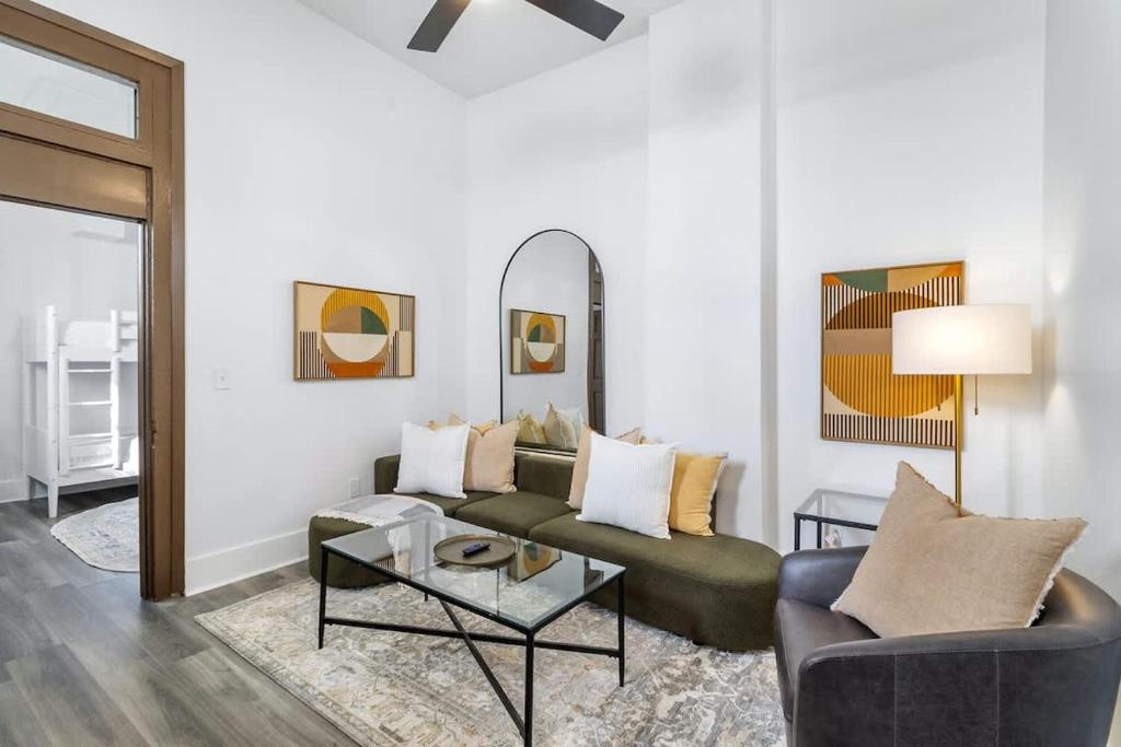 a living room with a couch and a table at Delightful Canal Street Family Home in Mid-City in New Orleans