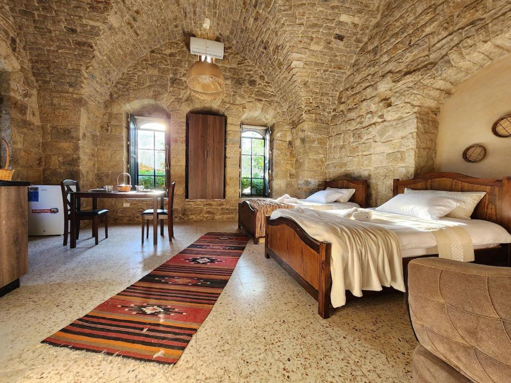 Llit o llits en una habitació de Dar al Rumman