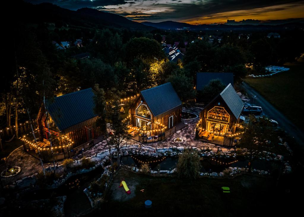 an aerial view of a house at night with lights at Stodoły Karkonoskie in Podgórzyn