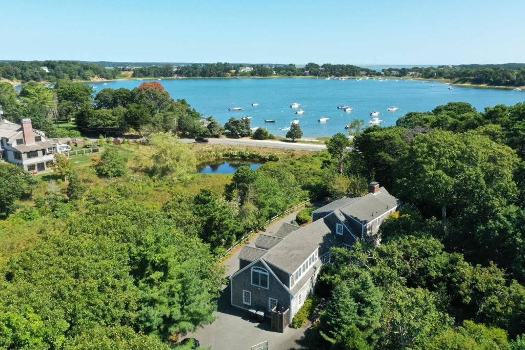 an aerial view of a house with a view of a lake at Luxury Waterfront with Game Room in Chatham