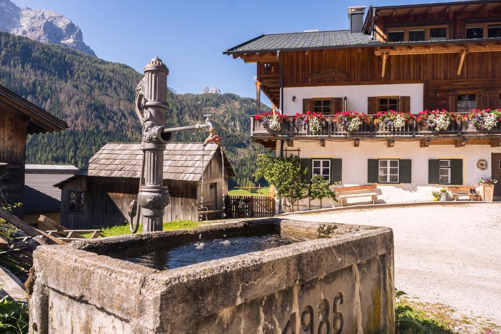 a water fountain in front of a building at Gesenhof in Sesto