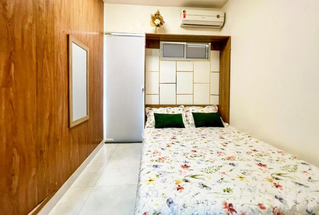 a bedroom with a bed in a room at Loft Studio - Lauro de Freitas in Lauro de Freitas