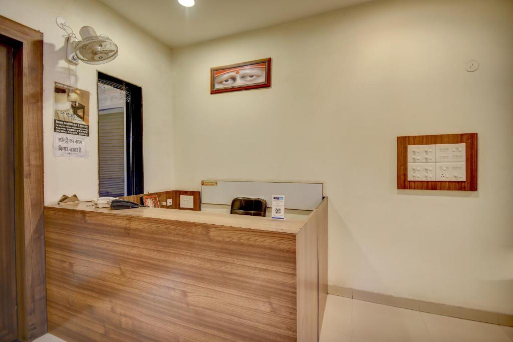 an office with a reception desk in a room at Super Hotel O Plus Corporate One in Nagpur
