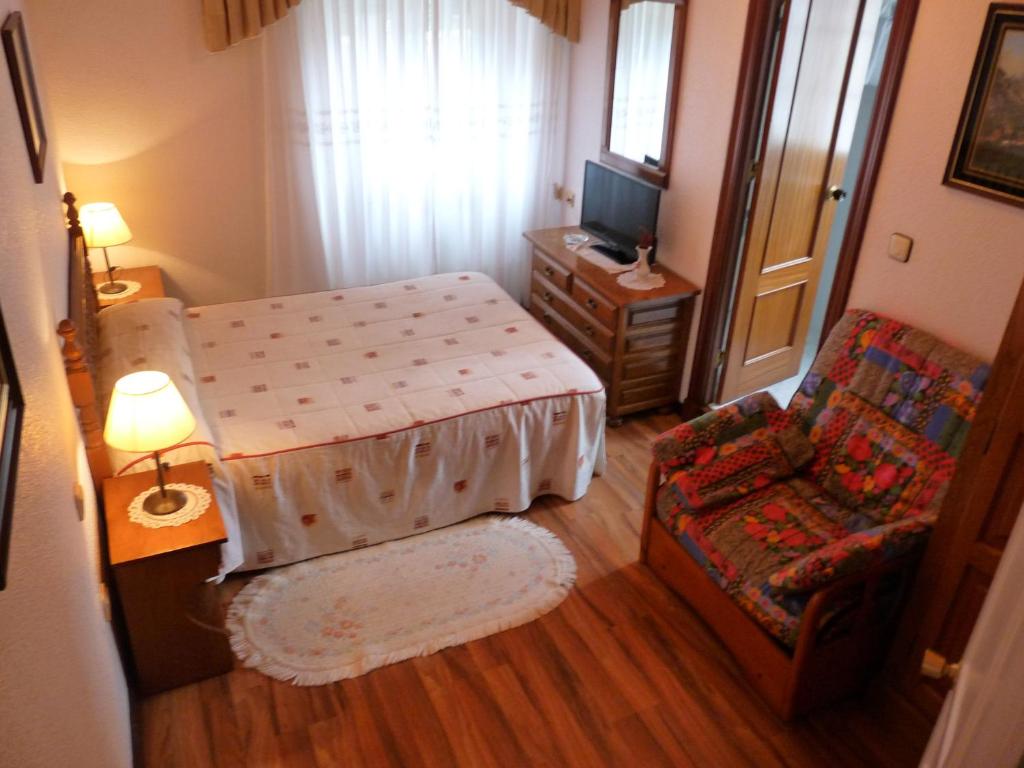 A bed or beds in a room at Hospedaje Roiz