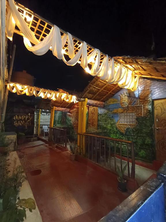 awning of a restaurant at night with lights at Hampi's Dream Cottage in Hampi