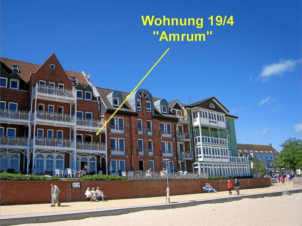 a kite is flying in front of a building at direct sea view Amrum in Wyk auf Föhr