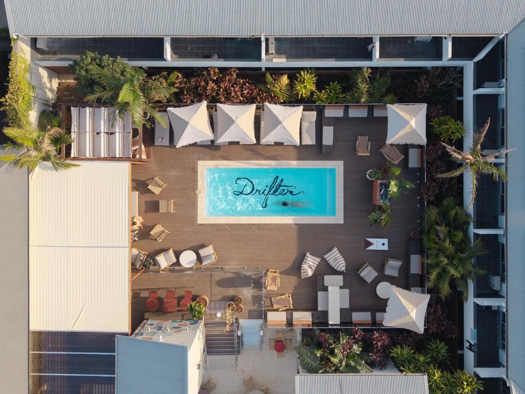 an overhead view of a building with a swimming pool at Drifter Byron Bay in Byron Bay