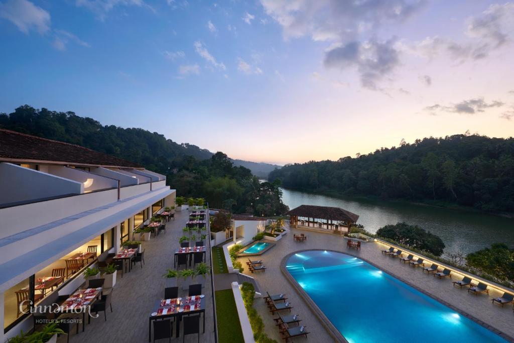 an aerial view of a resort with a river at Cinnamon Citadel Kandy in Kandy