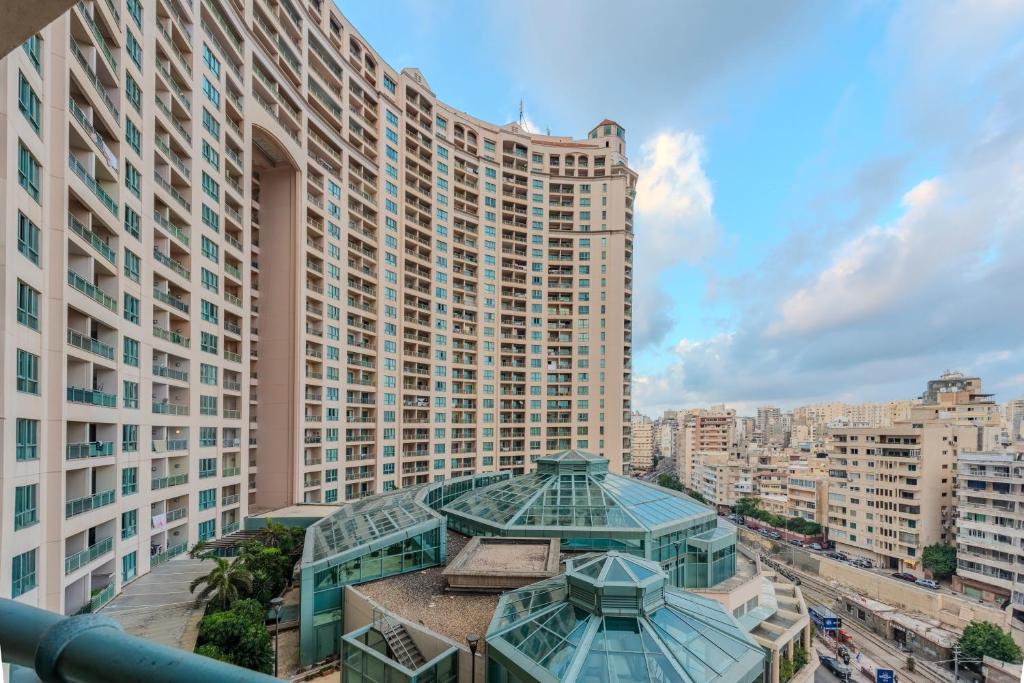 a view of a large building with two domes at Nabeel Homes - Four Seasons City View Residence in Alexandria