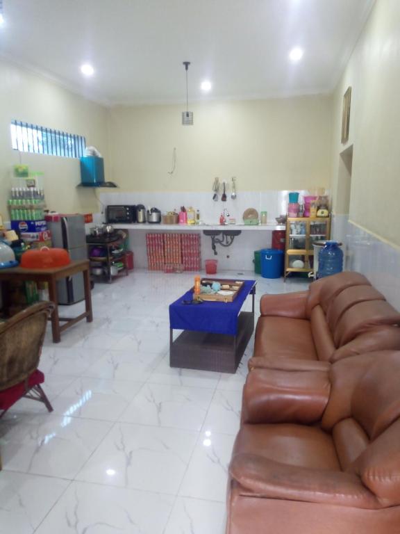 a living room with a couch and a table at Homestay Srey Mom in Kampot