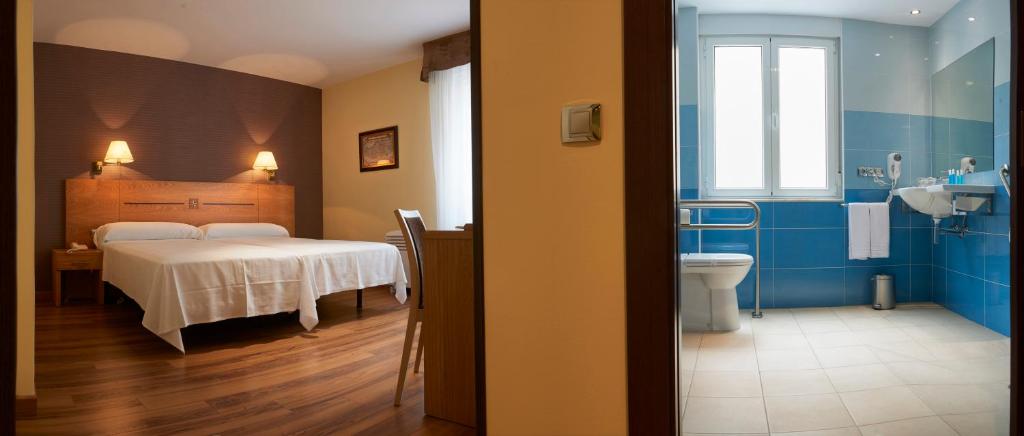 Postel nebo postele na pokoji v ubytování Hotel 40 Nudos