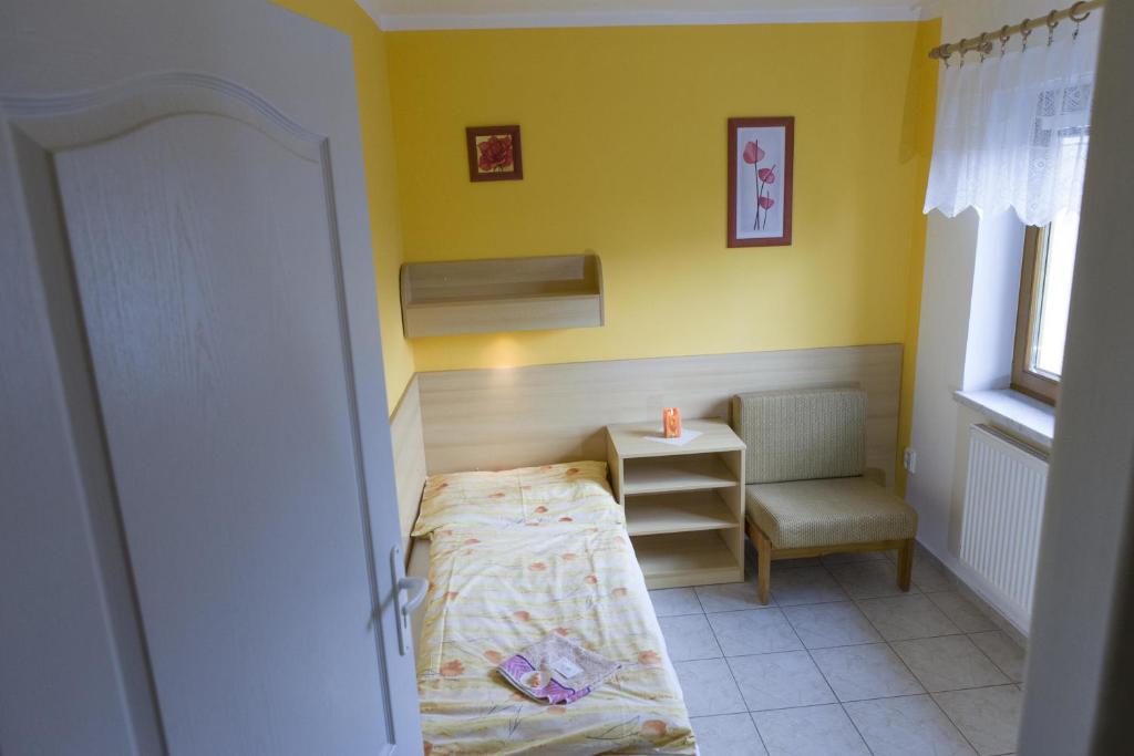 Postel nebo postele na pokoji v ubytování Penzion Alfa