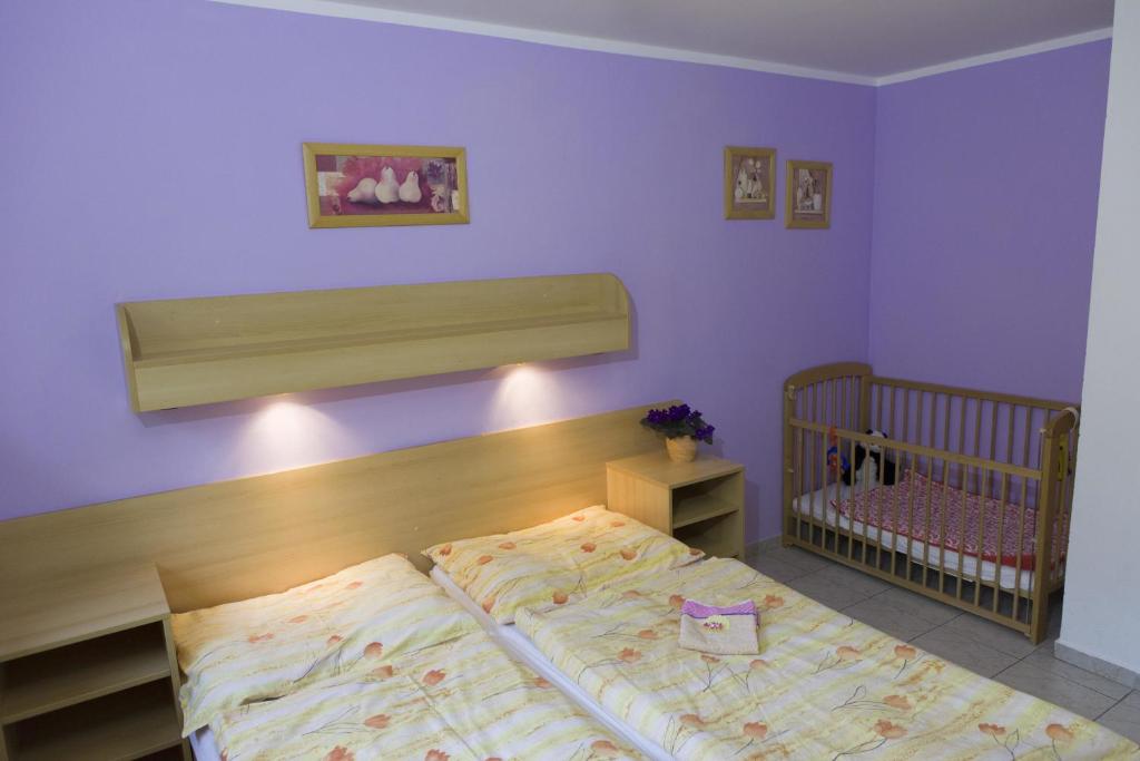 Postel nebo postele na pokoji v ubytování Penzion Alfa
