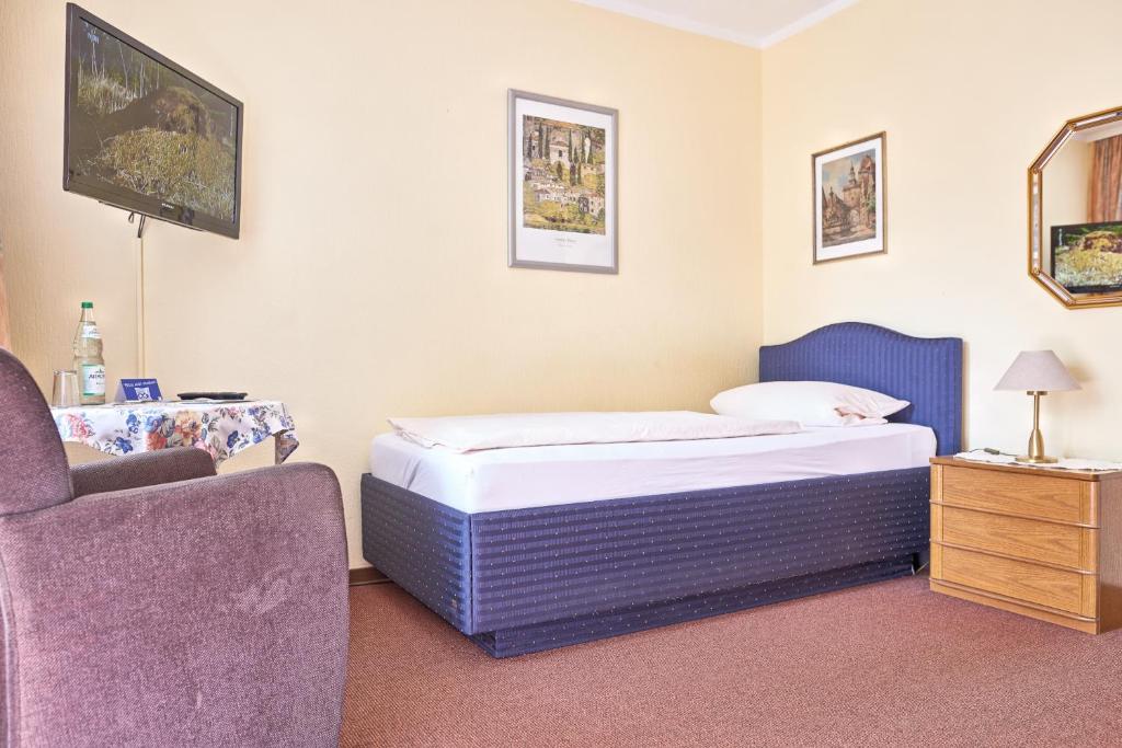 Postel nebo postele na pokoji v ubytování Hotel-Pension Elfi