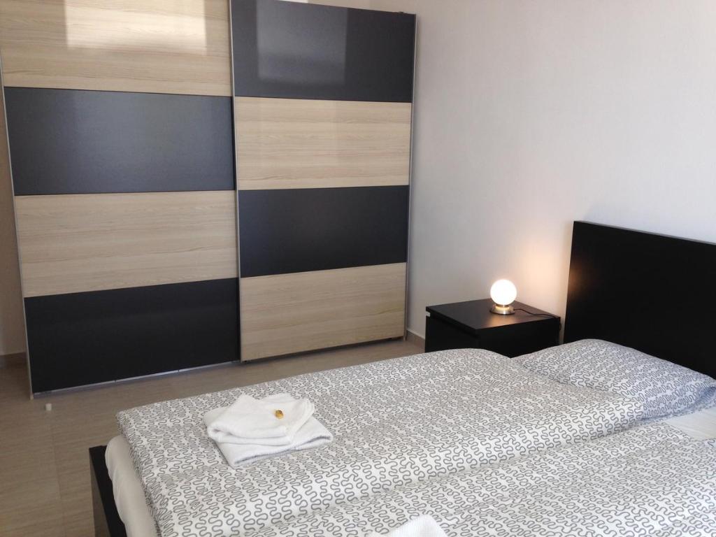 Postel nebo postele na pokoji v ubytování Apartmány Hlohovec