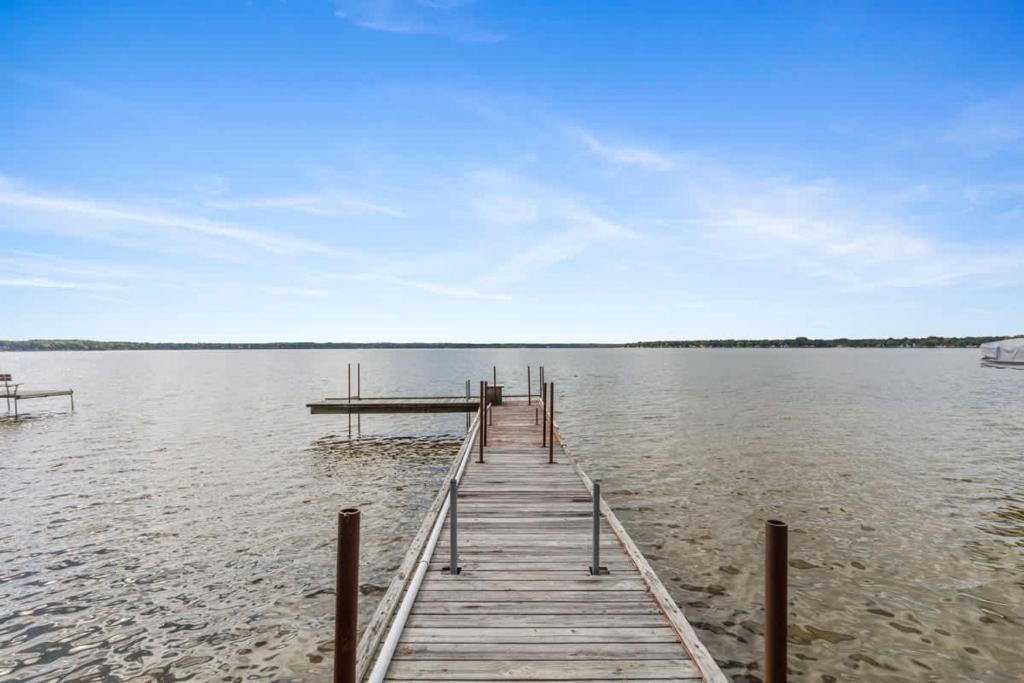 a dock in the middle of a body of water at Upper Level Lakeview suite in Lake City