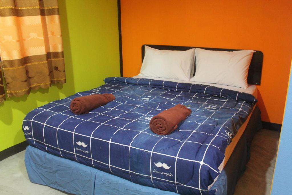 Postel nebo postele na pokoji v ubytování Rc Guest House