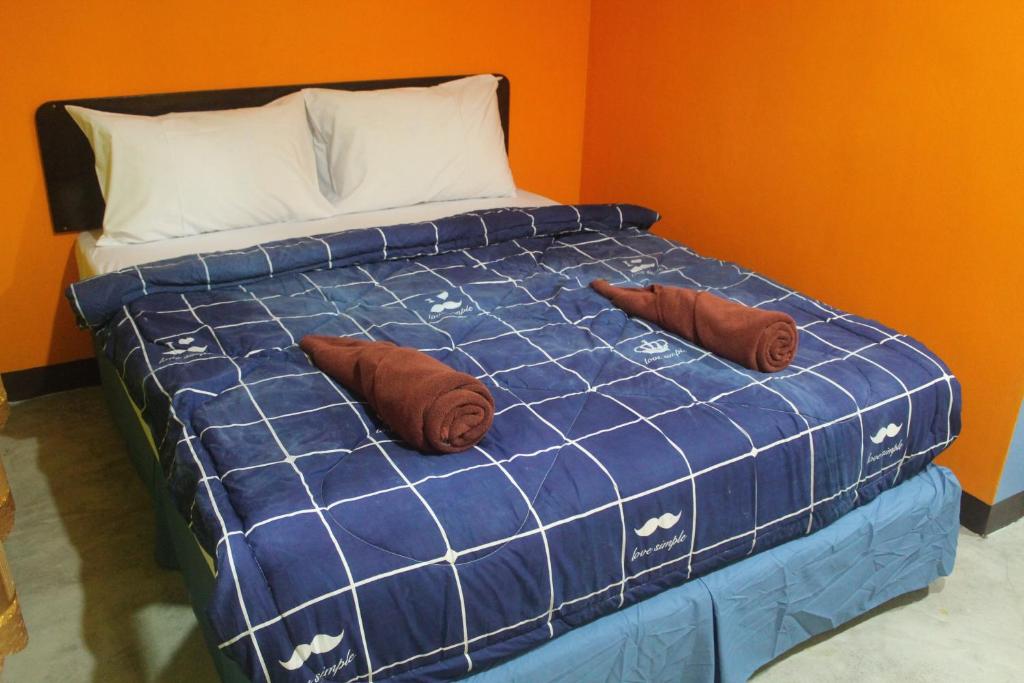 Postel nebo postele na pokoji v ubytování Rc Guest House