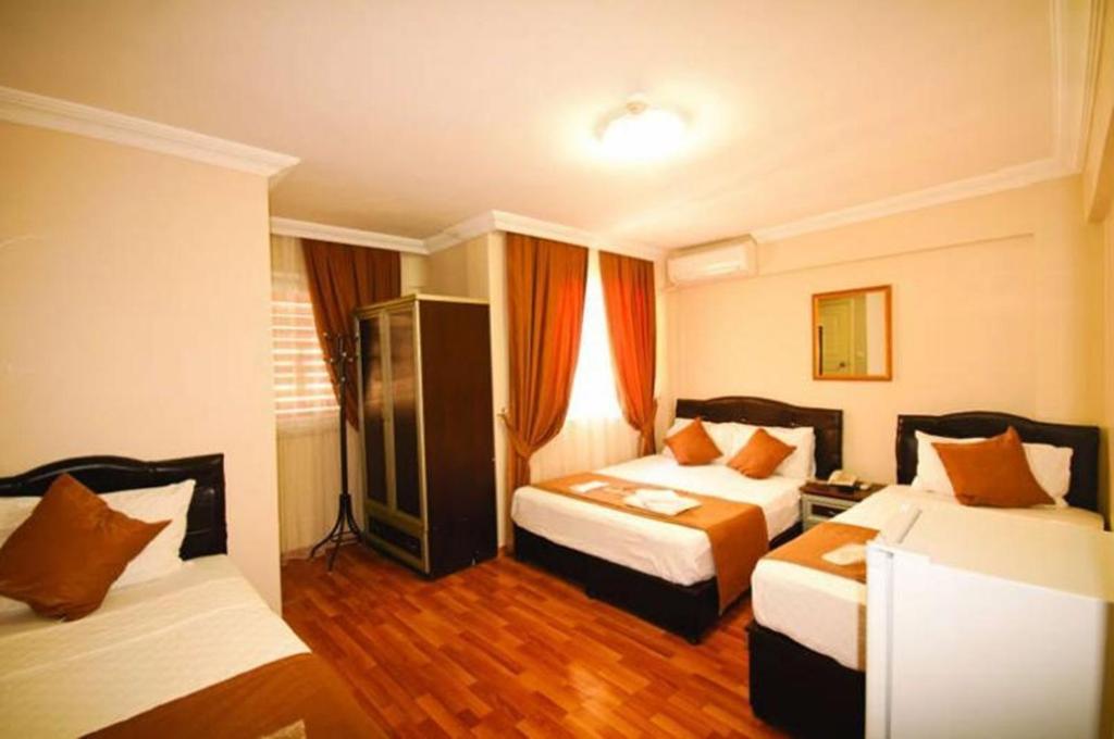 En eller flere senger på et rom på Simal Butik Hotel