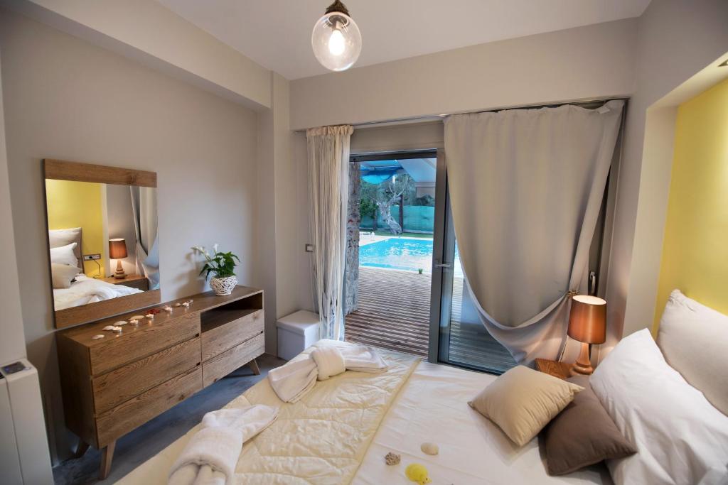 Postel nebo postele na pokoji v ubytování Lefkas Villas
