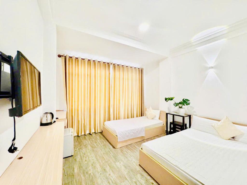 Ένα ή περισσότερα κρεβάτια σε δωμάτιο στο New Sunny Hotel