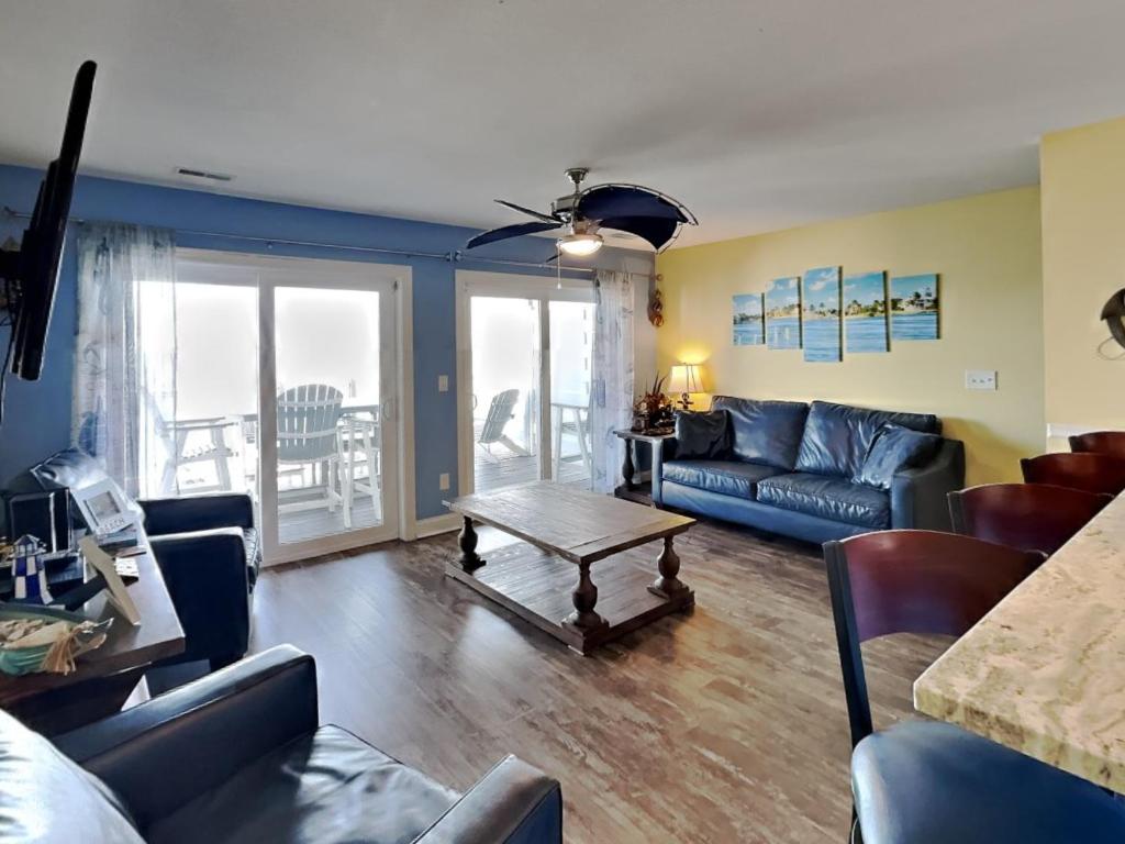 a living room with a couch and a table at Put-in-Bay Waterfront Condo #206 in Put-in-Bay
