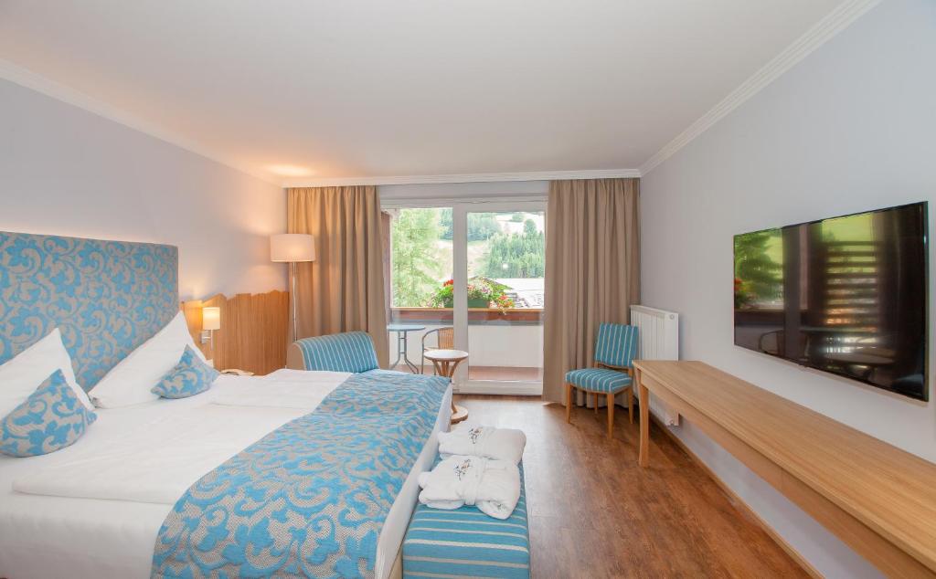 Postel nebo postele na pokoji v ubytování Evident Hotel Prägant 4-Superior
