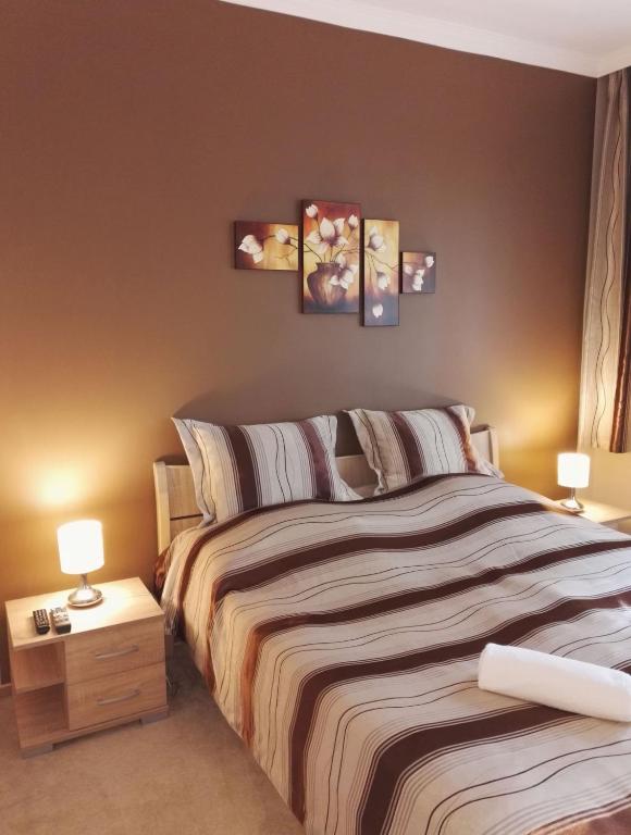 Postel nebo postele na pokoji v ubytování Adél Apartman