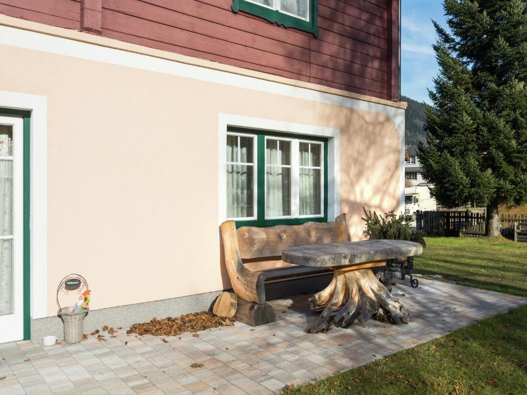 a bench sitting in front of a building at Renovated Mountain Retreat Stay in Pruggern