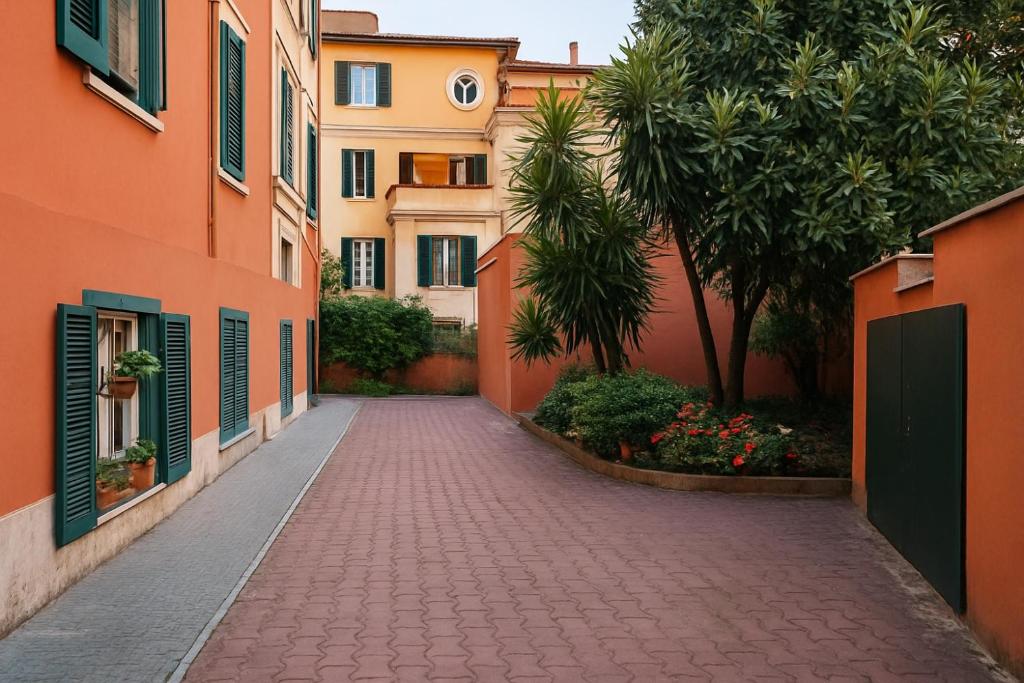 an alley in a city with orange buildings at Like at Home Trastevere in Rome